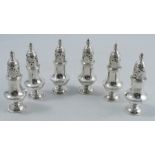 A set of six 19th century silver pepper pots, of baluster form, with engraved and pierced pull off