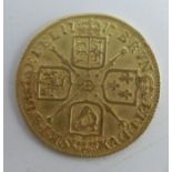 A George I gold guinea, dated 1717, weight 8g