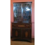 An 18th century mahogany secretaire bookcase, with astragal glazed doors to the upper section, the