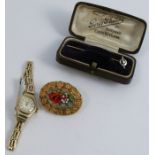 A lady's 9 carat Bentima wrist watch, on a metal bracelet, together with a diamond set stickpin