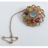 An early Victorian multi-gem brooch, set with aquamarine, chrysoberyl cats eye, topaz, garnet and