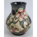A Moorcroft pottery baluster vase, decorated in the Hellebore pattern, dated circa 1999, height 6.