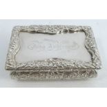 A 19th century silver table snuff box, of rectangular form, with raised floral border, the top