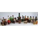 A collection of alcoholic miniatures, some in novelty bottles, to include fruit liqueurs, Cherry