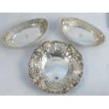 A pair of pierced silver oval dishes, with bead edge and engraved with crest and initials, London