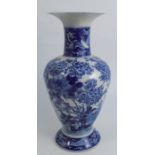 An Oriental baluster shaped vase, decorated with trees, birds and flowers, character marks to