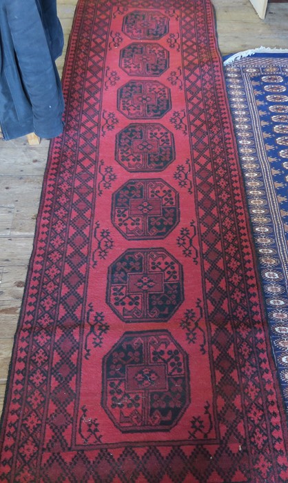 Two 20th century Eastern design runners, 116ins x 32ins and 96ins x 32insCondition Report: The red