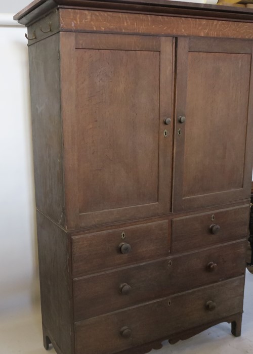 A 19th century oak linen press, the cupboard fitted with shelves, the base with two short over three - Image 2 of 3