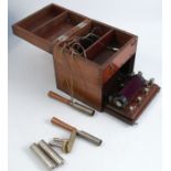 A mahogany cased electric shock machine, with rising lid and fall flap to the front