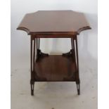 An Art Nouveau walnut occasional table, fitted with an under-shelf, having shaped, pierced
