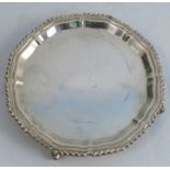 A silver tray, with shaped gadrooned border, raised on three knurl feet, Birmingham 1968, weight