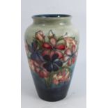 A Moorcroft pottery vase, decorated in the Spring Flowers and Orchid pattern, height 8.