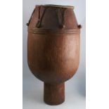 A tribal carved wooden and skin floor standing drum, height 34.5ins