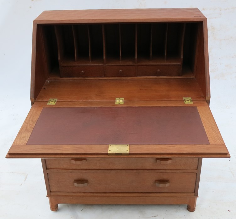 Alan Grainger Acorn Man, an oak bureau, the fielded fall flap opening to reveal pigeon holes and - Image 2 of 7