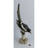 A large Meissen porcelain model, of a Magpie on a stump, af, height 21insCondition Report: Top of