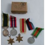 A group of medals, to include a Territorial Efficiency Service Medal, a 1939-1945 Defence Medal,