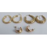 A pair of 9 carat gold hoop earrings, together with another similar pair, and a pair of unmarked