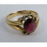 An 18 carat gold garnet set ring, finger size R, 5.8g gross