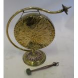 A 19th century Arts & Crafts copper and brass botanical style table gong, with flower finial, in the
