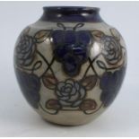 A Royal Doulton stoneware bulbous vase, decorated with alternate grapes and flower heads in blue,