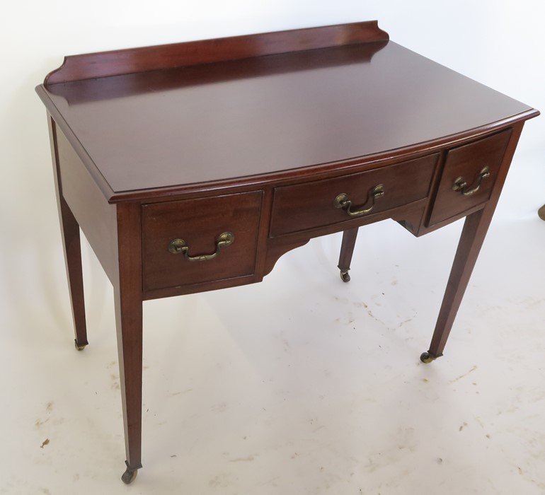 An early 20th century Heal's bow front mahogany knee-hole dressing table, with three drawers, - Image 2 of 3