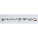 A collection of seven 9 carat gold stone set dress rings, 18g gross
