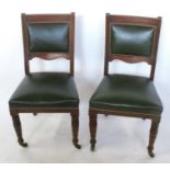 A set of six oak dining chairs, with carved and upholstered backs, raised on carved front supports