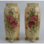 A pair of Royal Worcester blush ivory vases, with pierced necks and decorated with floral sprays,
