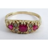 A 9 carat gold diamond and ruby ring, in the antique style, finger size T 1/2, 2.6g gross