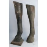 Two composition horses front legs, one mounted on a wooden plinth, heights 27.5ins and 30ins