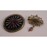 An Austro-Hungarian gem set brooch, 2.9cm across, together with a gilt metal carved agate brooch