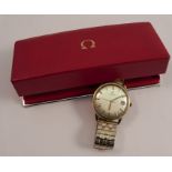Omega, a gentleman's 9 carat gold automatic wrist watch, the white dial with gilt black batons,