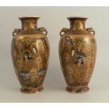 A pair of Satsuma pottery vases, decorated with figures, marked to base, height 10insCondition