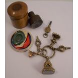 A collection of three seal fobs, together with three watch keys, a steel seal fob for a press, in