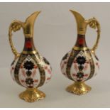 A pair of Royal Crown Derby ewers, decorated in the 1128 Imari pattern, dated 1989, height 10.