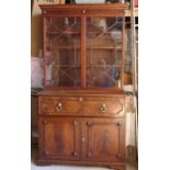 A 19th century mahogany secretaire bookcase, the glazed upper section with adjustable shelves, the
