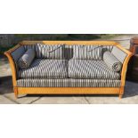 A Biedermeier style mahogany framed settee, with striped fabric, width 80ins