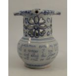 An Antique Liverpool blue and white Delft puzzle jug, decorated with verse and flowers, height