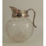 A glass and silver plated mounted jug, with bulbous glass body, height 8.5ins