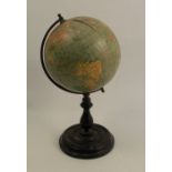 A Philips 6inch terrestrial globe, raised on a turned ebonised base, height approximately 11ins