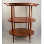 A three tier satinwood etager, of oval form, with line inlay and chequer banded borders, raised on