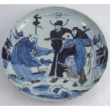 A late 19th century Chinese export circular shallow dish, decorated in blue and white with figures