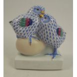 A Herend model, of two fledgling birds with an egg, raised on a square base, height 4.75insCondition