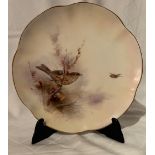 A Royal Worcester plate, decorated with a linnet by James Stinton, circa 1912, diameter 8.