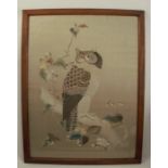 A Japanese tapestry picture, of an owl on a bench with flowers, 26ins x 19ins