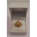 An Eastern split pearl set ring, in unmarked yellow gold, tests as 18 carat gold, finger size O, 6.