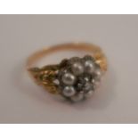 A Victorian diamond and pearl cluster ring, the eight pearls (untested and unwarranted) enclosing