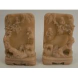 A pair of carved stone book ends, decorated with monkeys and a tree, height 6ins
