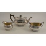 A silver three piece tea set, with gadrooned edge and reeded band, Sheffield 1919, maker James Dixon