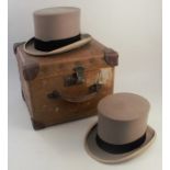 A Locke & Co London grey top hat, in a fitted hat box, together with a Robert Heath grey top hat